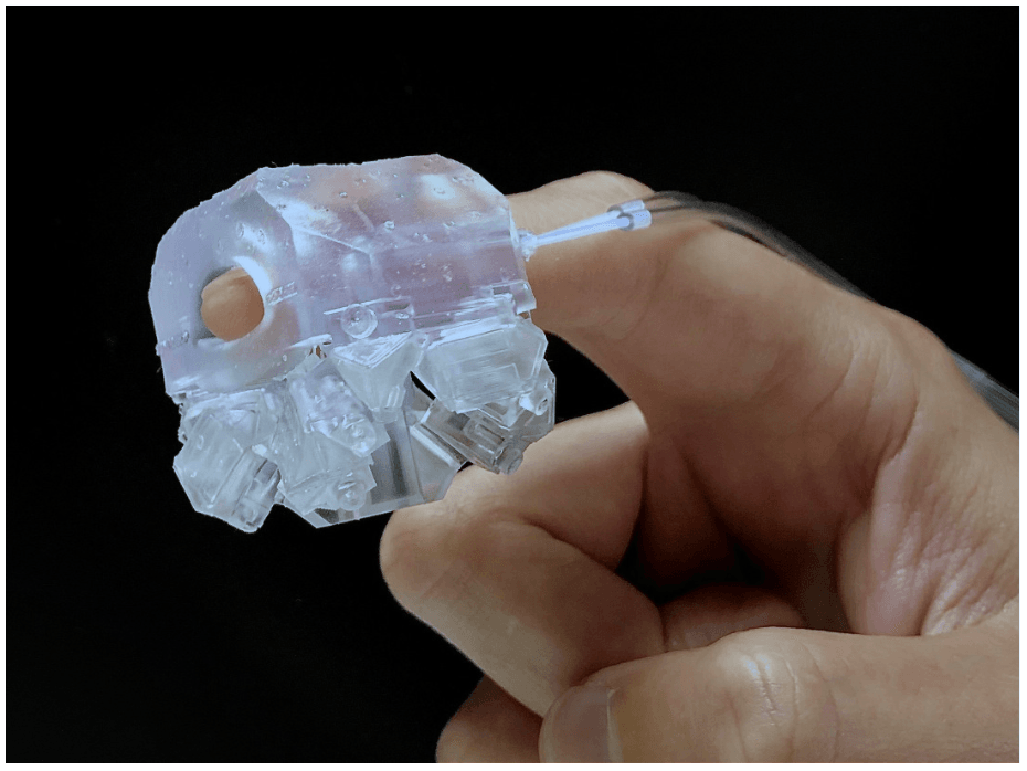 The TherMosaic system's wearable prototype delivers responsive temperature feedback to the fingertip, avoiding bulky cooling hardware.