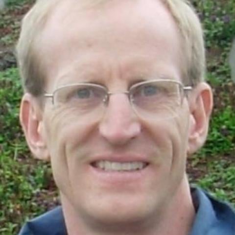 Subatomic collision calculations reach nine loops with artificial intelligence