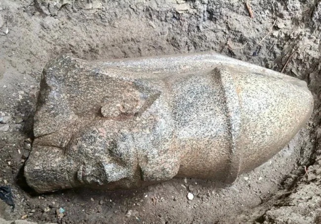 Two monumental statues of Ramesses II emerge from northern Egyptian farmland