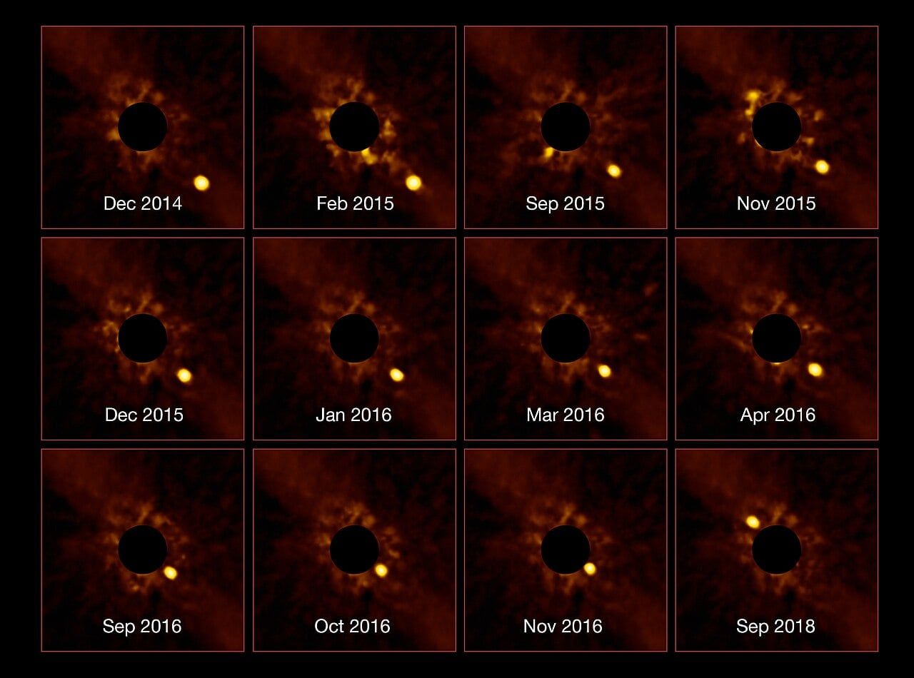 Four giant exoplanets orbit a distant star across twelve years