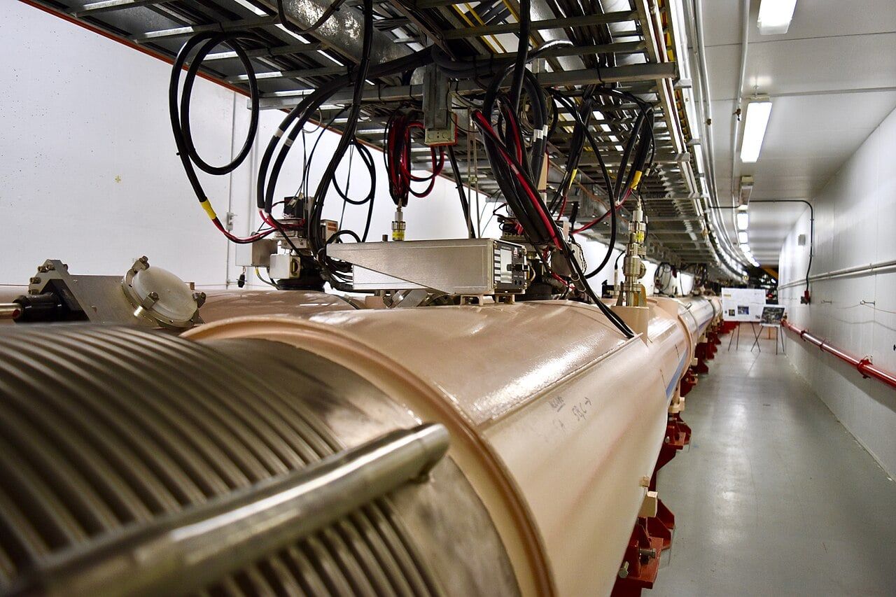Colliding gold atoms reveal an unexpected dip in primordial matter fluctuations